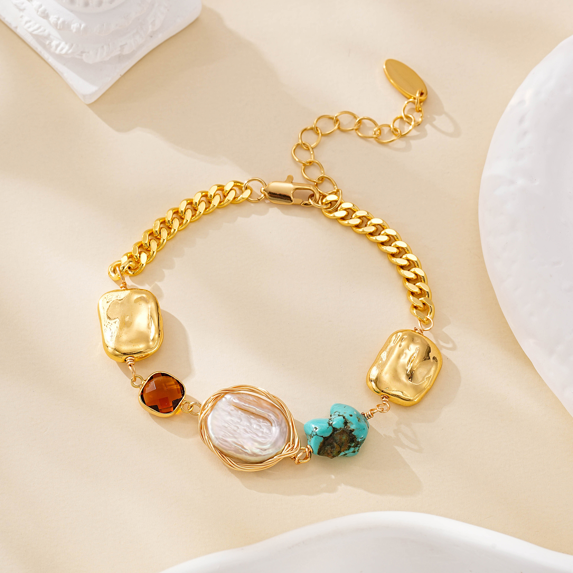 Turquoise and pearl bracelet arranged in a circle with gold-tone links