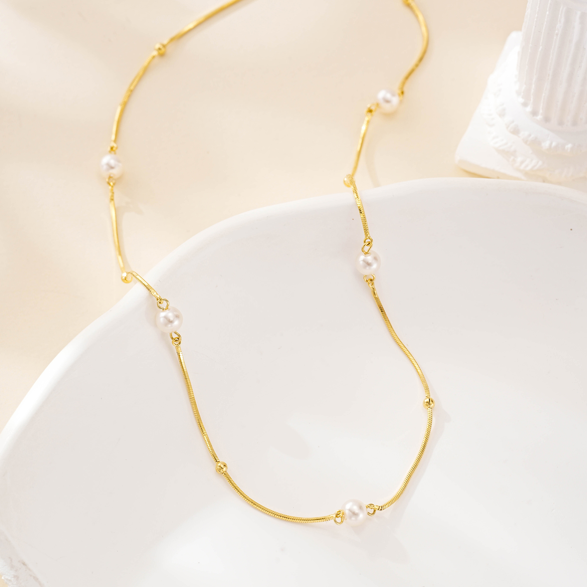 Close view of freshwater pearls along the shorter necklace