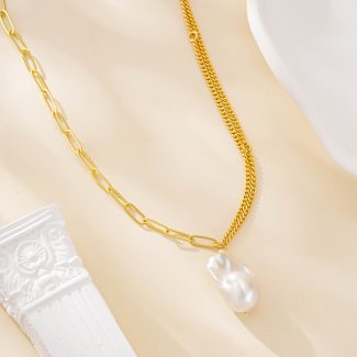 Asymmetric mixed-chain necklace with a large white baroque pearl pendant