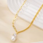 Gold-tone mixed-link necklace with organic baroque pearl pendant