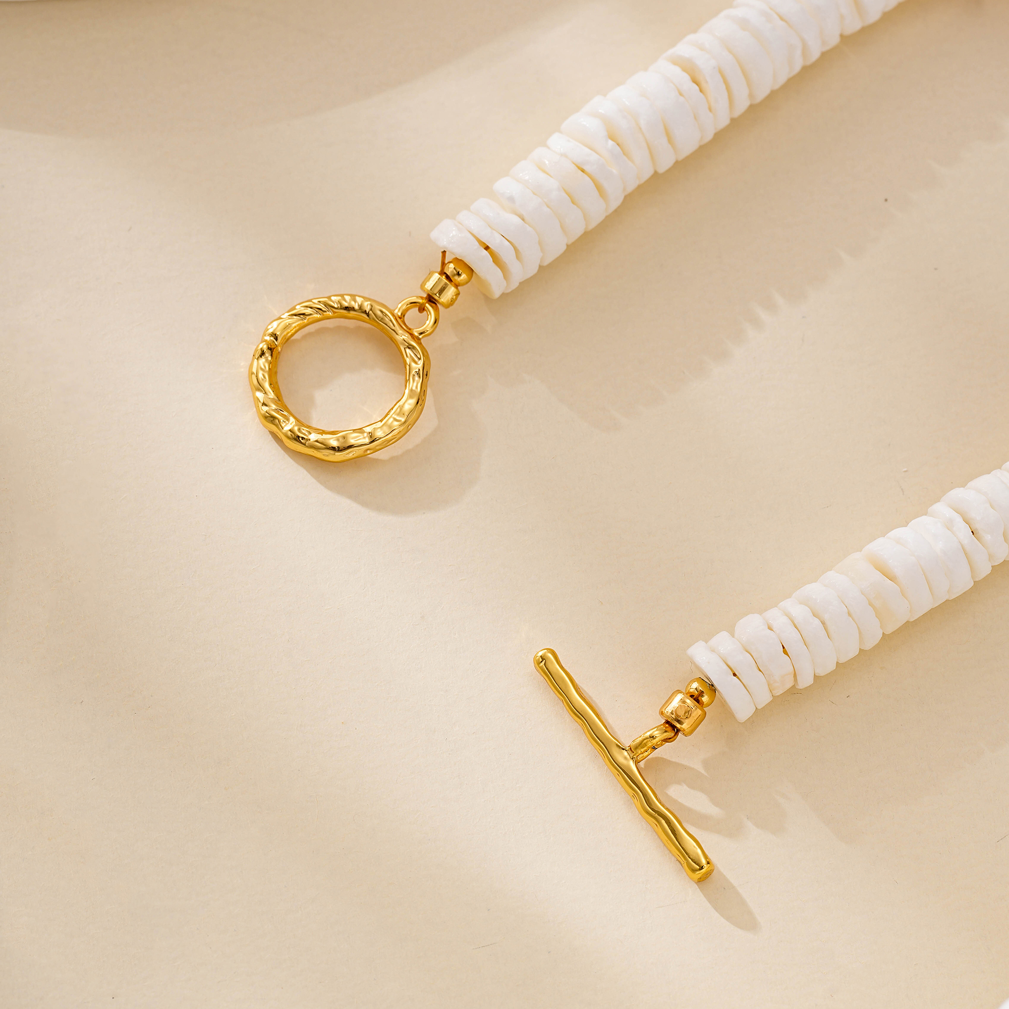 Shell disc bracelet showing its toggle clasp and organic shapes