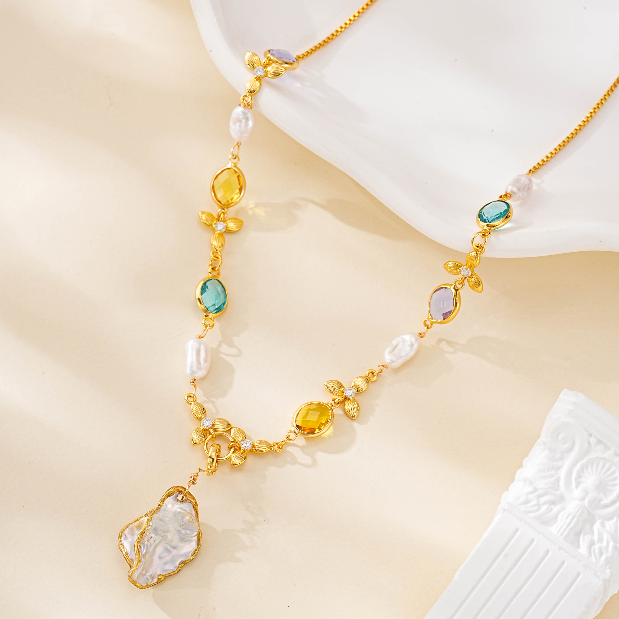 Close view of irregular gold-edged baroque pearl pendant