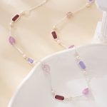 Silver-tone necklace with purple gemstones and white freshwater pearls