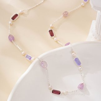 Silver-tone necklace with purple gemstones and white freshwater pearls