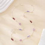 Fine chain showing alternating purple gemstones and freshwater pearls