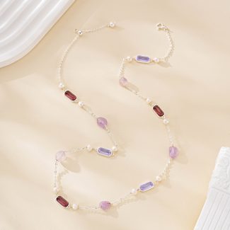 Fine chain showing alternating purple gemstones and freshwater pearls