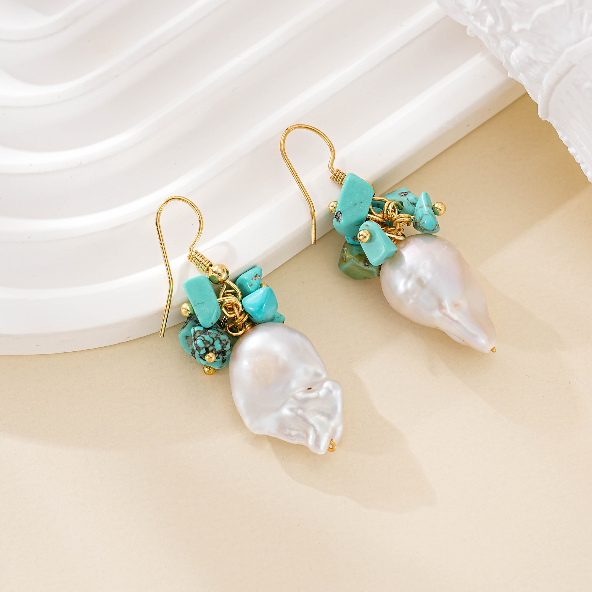Gold-tone hook earrings with turquoise clusters and baroque pearls