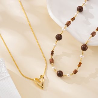 Layered open heart and wood bead pearl necklace set shown together