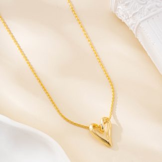Fine gold-tone chain with open heart pendant from the set