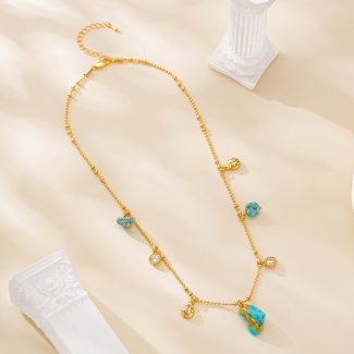 Turquoise charm necklace with irregular central pendant on bead chain