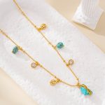 Gold-tone beaded chain with turquoise and sparkling accents