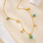 Turquoise pendant necklace laid out to show full design