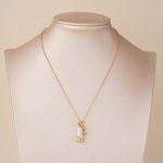 Spiral baroque pearl necklace displayed on a bust