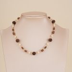 Open heart pendant necklace displayed on a jewelry bust