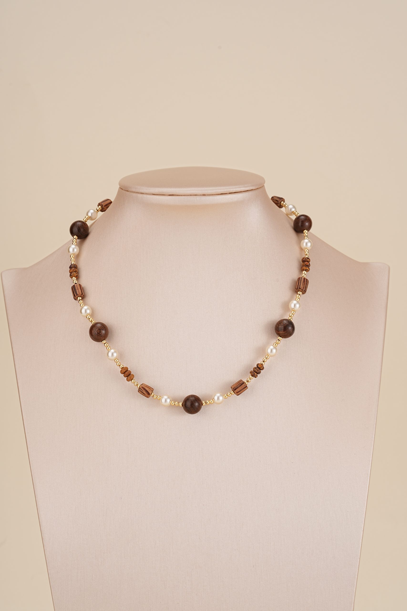 Open heart pendant necklace displayed on a jewelry bust