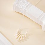 Close-up of nine freshwater pearl tassels hanging from a fine silver-toned chain