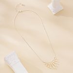 Full length view of delicate nine-strand pearl fringe necklace