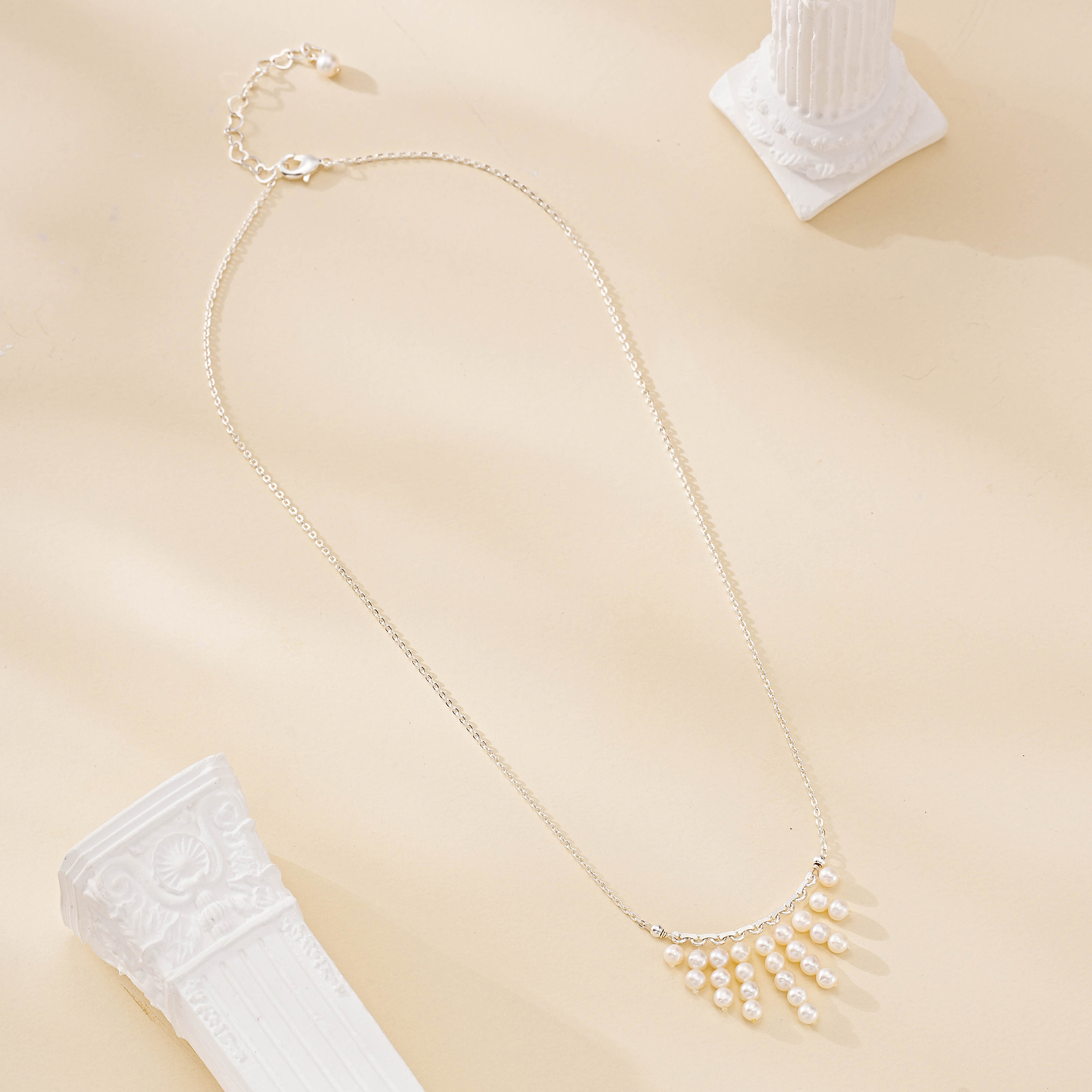 Full length view of delicate nine-strand pearl fringe necklace