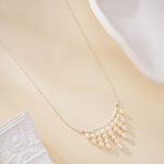 Silver-toned necklace with nine cascading freshwater pearl fringe strands