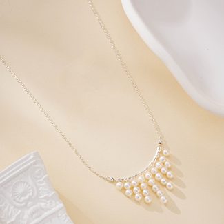 Silver-toned necklace with nine cascading freshwater pearl fringe strands