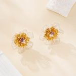 Coordinating wire flower earrings and bracelet set, close-up of gold-plated copper details
