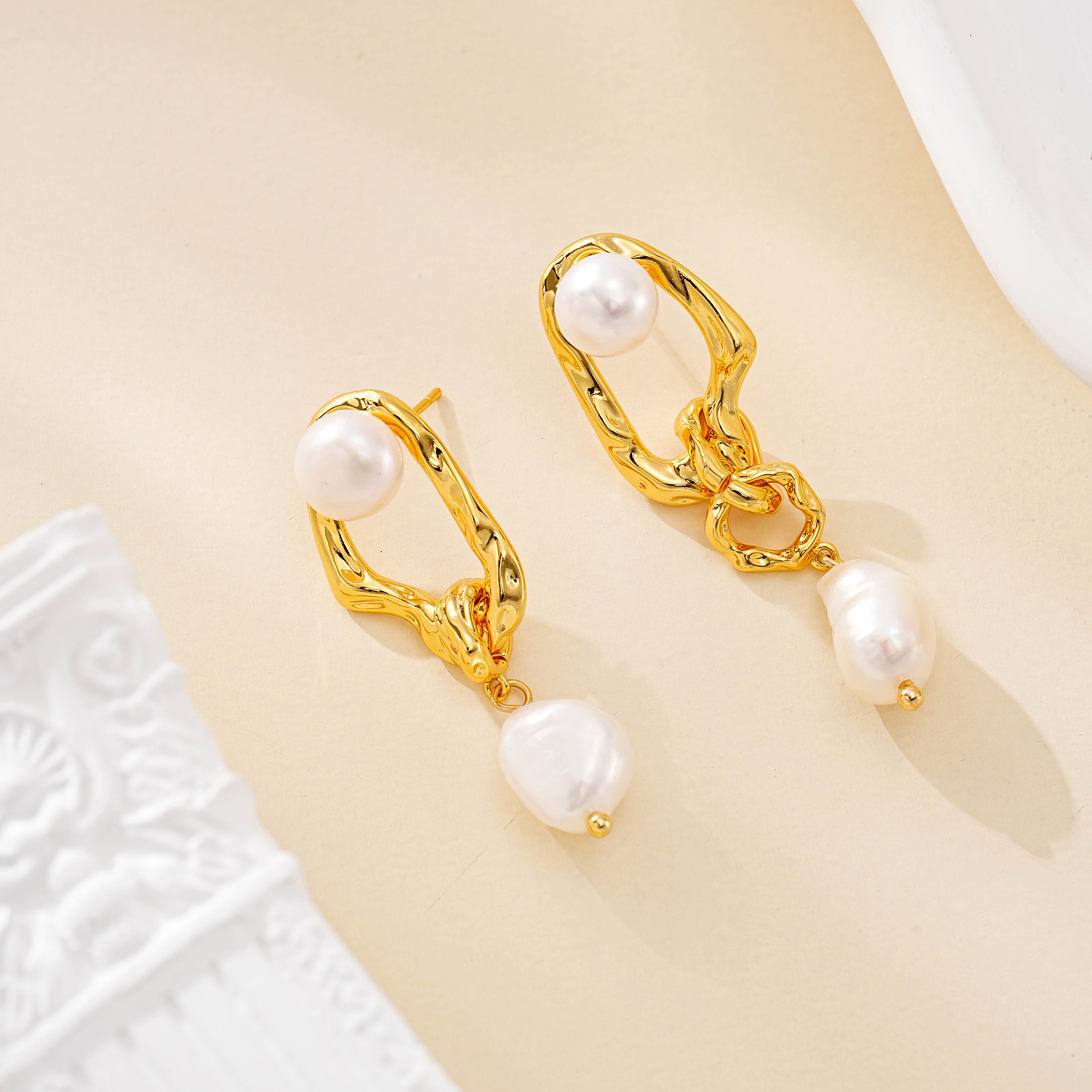 Asymmetric gold-toned drop earrings with round and baroque freshwater pearls