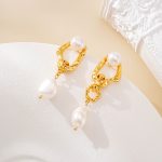 Close-up of round pearl studs and irregular pearl drops