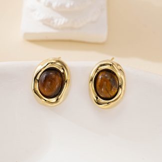 Pair of oval tiger eye stud earrings in sculptural gold-toned settings