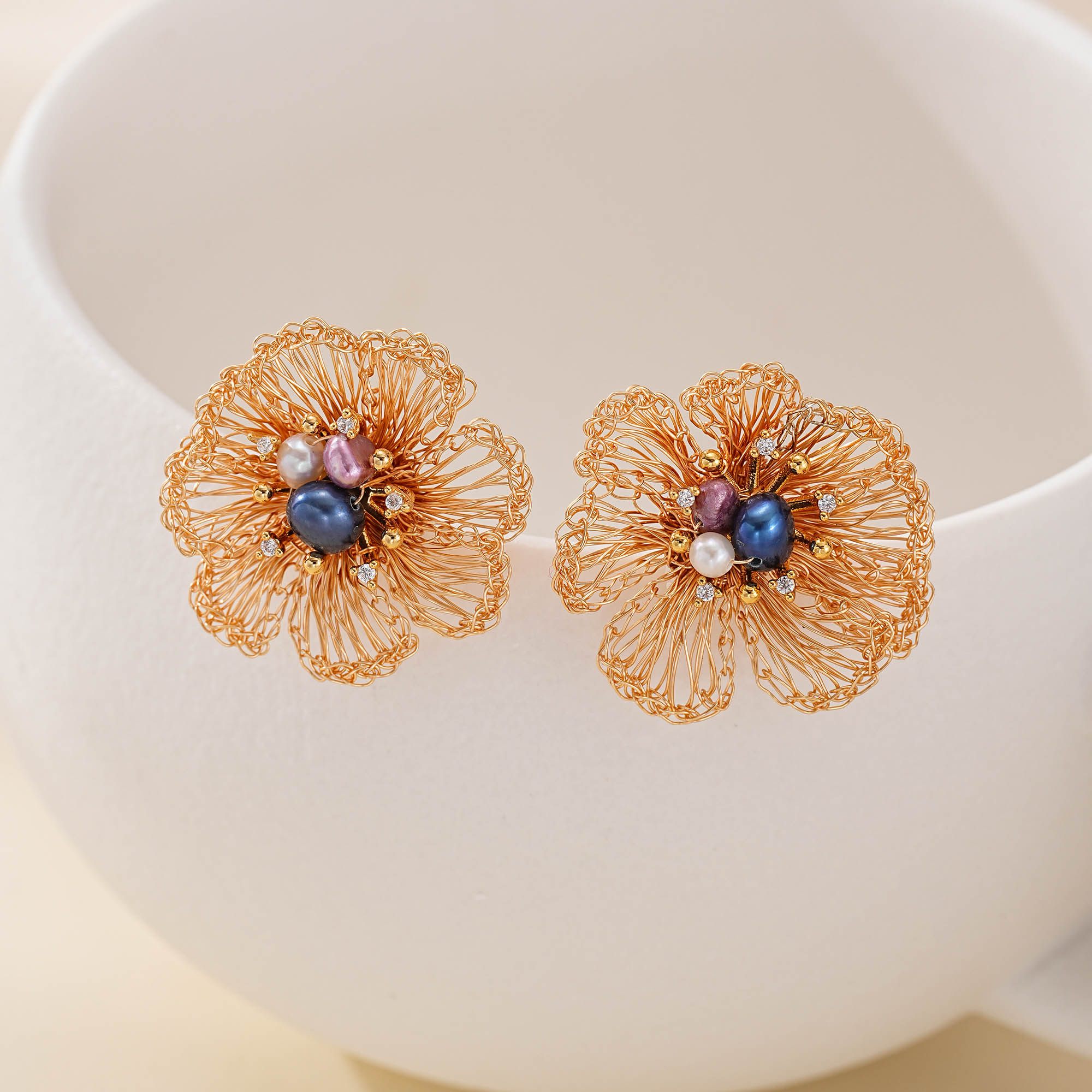 gold-finish flower earrings with multicolor pearls