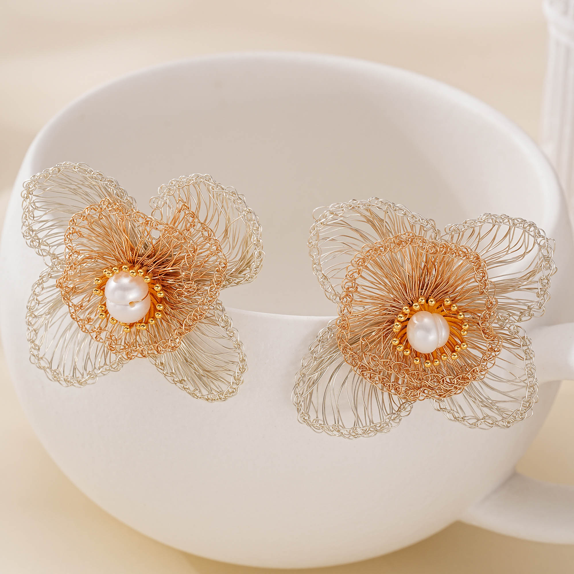 Wirework detail of Two-Tone Four-Petal Pearl Earrings
