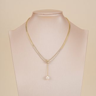 Gold-tone pearl drop snake chain necklace displayed on a jewelry bust