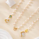 Layered view of freshwater pearl necklace with green and honey-colored accents