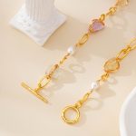 Gold-toned toggle clasp and mixed gemstone details of pearl necklace