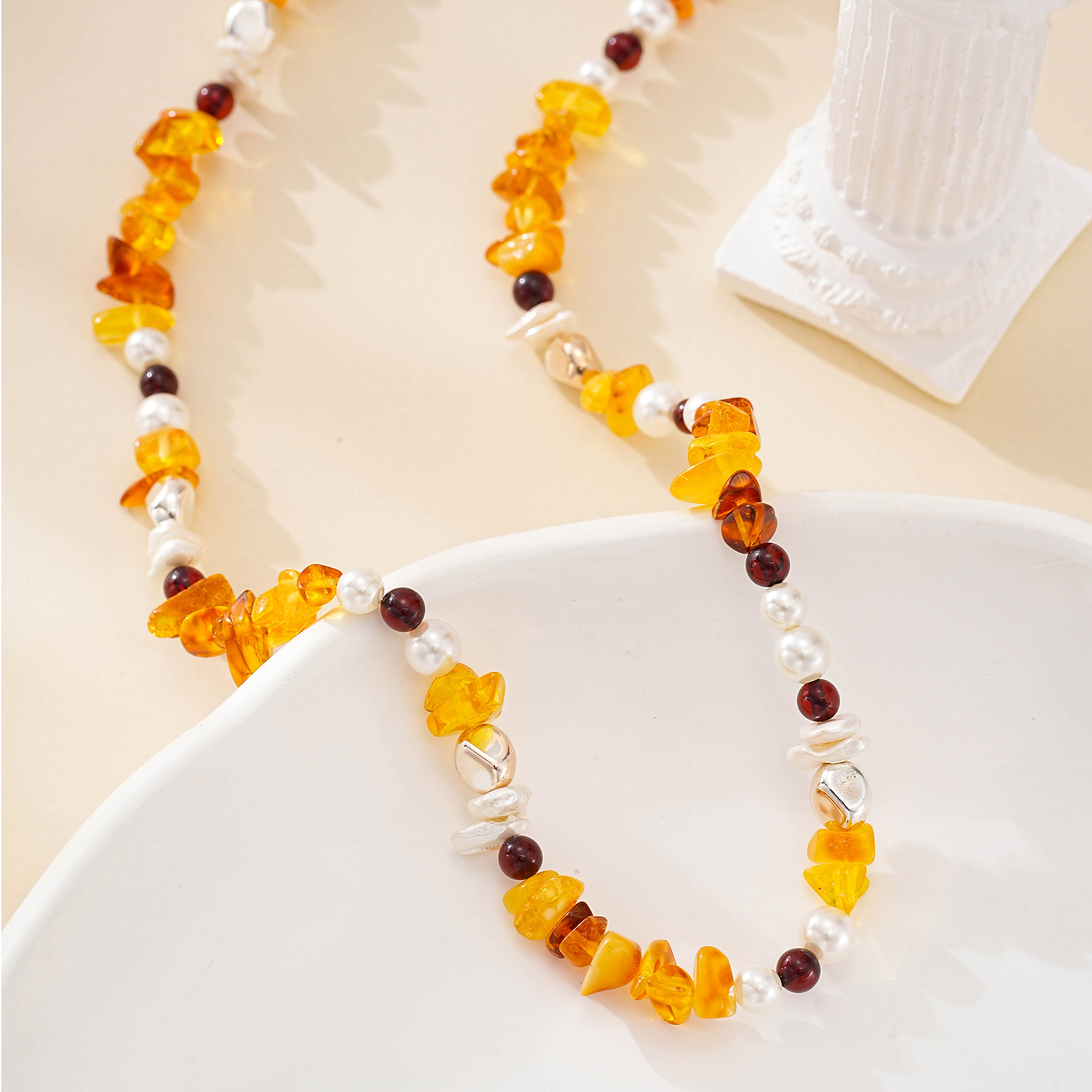 Amber-toned gemstone chip and baroque pearl necklace with dark round beads