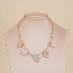Blush baroque pearl fringe necklace displayed on a neutral bust