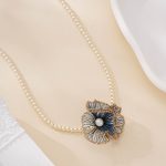 pearl necklace with detachable blue flower pendant