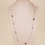Baroque pearl and resin station necklace displayed on a bust