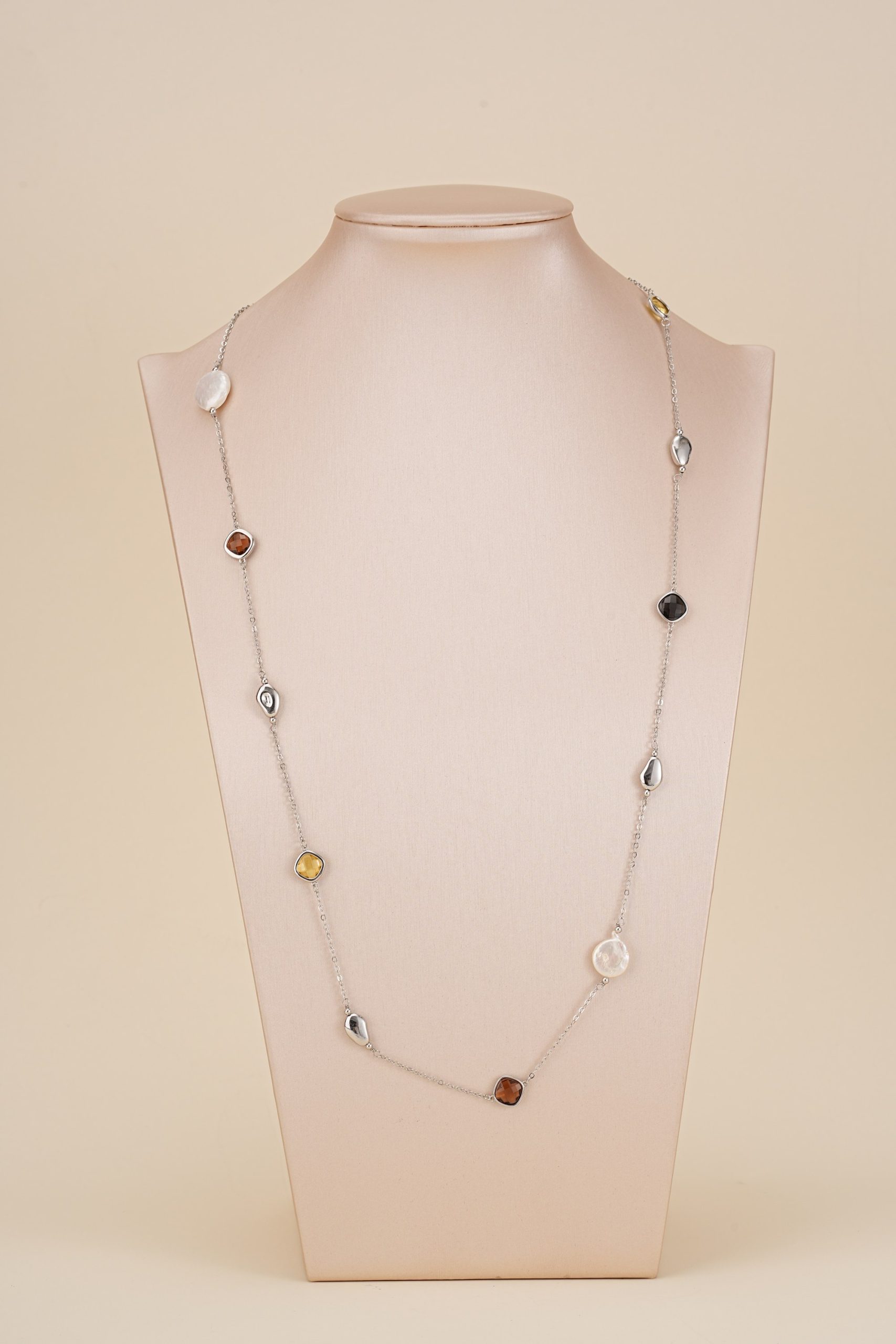 Baroque pearl and resin station necklace displayed on a bust