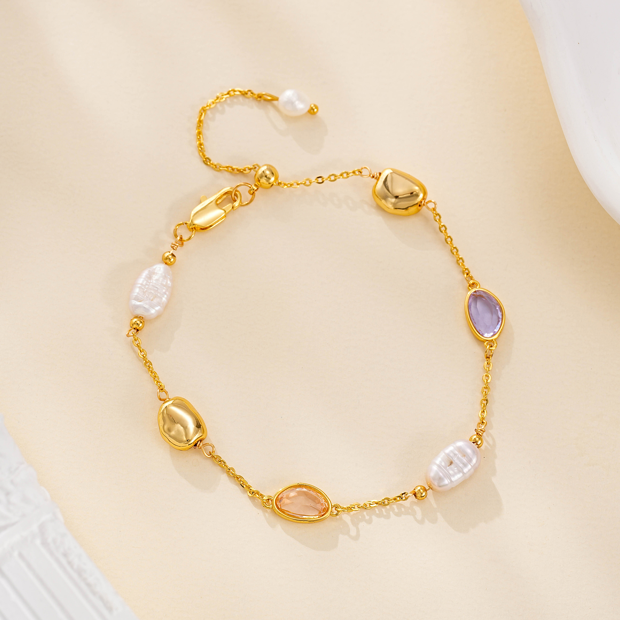 Bracelet with pearl accents, pastel oval stones and gold-tone beads