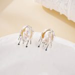 Irregular pearl shape within a fluid silver-tone earring frame