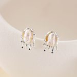 Baroque pearl studs with softly rippled silver-tone metalwork