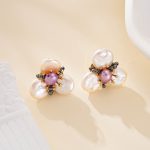 Three-petal white baroque pearl flower studs with purple pearl centers