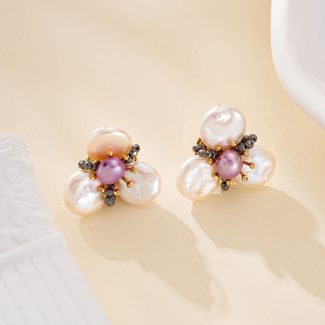 Three-petal white baroque pearl flower studs with purple pearl centers
