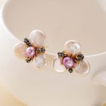 Petal-shaped baroque pearls in a gold-toned flower setting