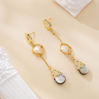 Asymmetrical pearl drop earrings with dark shell teardrops