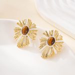 Close view of the oval tiger's eye and textured sunburst metalwork