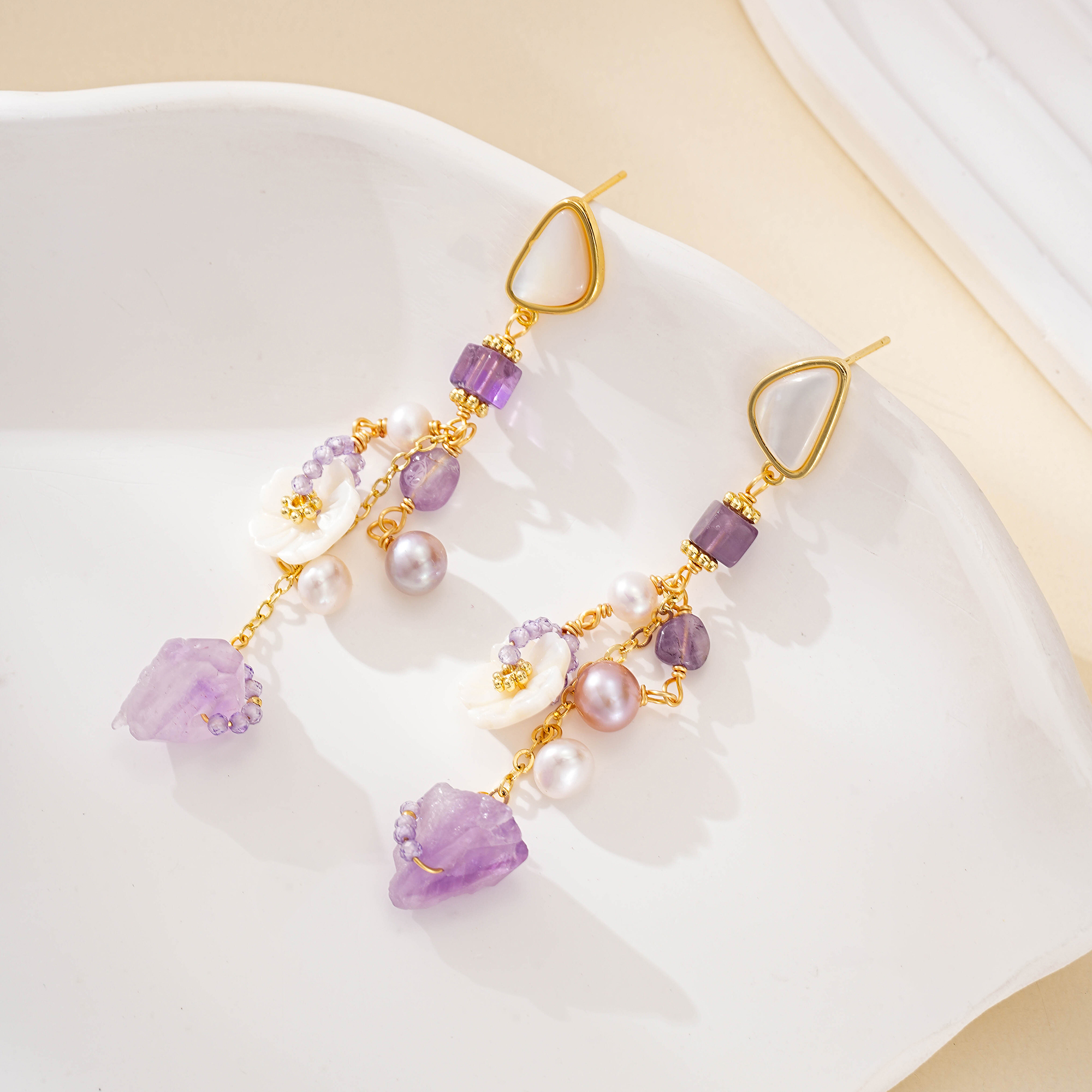 Amethyst and pearl tassel earrings with white floral accents