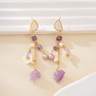 Mother-of-pearl tops above purple stone and pearl dangles