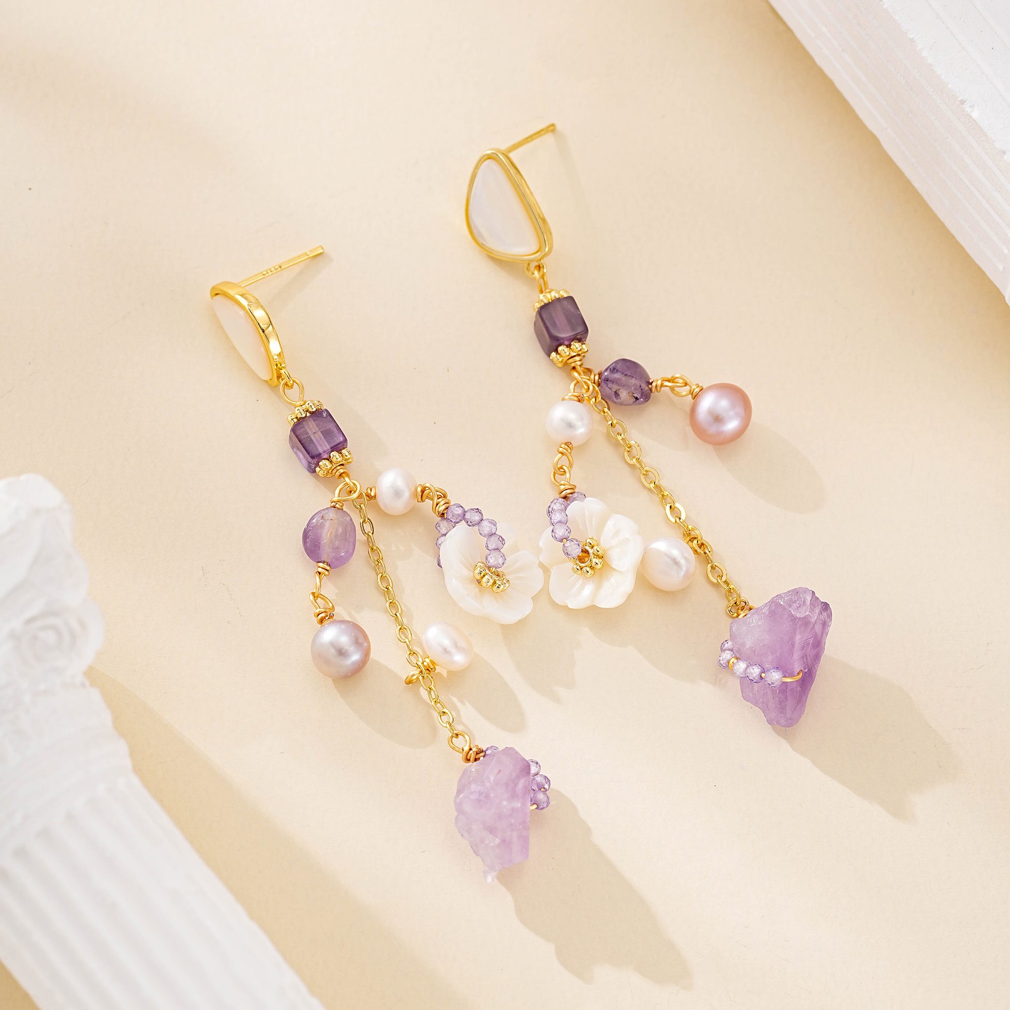 Pair of long purple and white floral pearl drop earrings