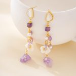 Gold-tone chains and mixed purple stones on floral tassel earrings